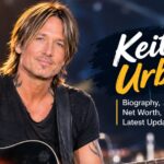 Keith Urban performing live on stage with guitar